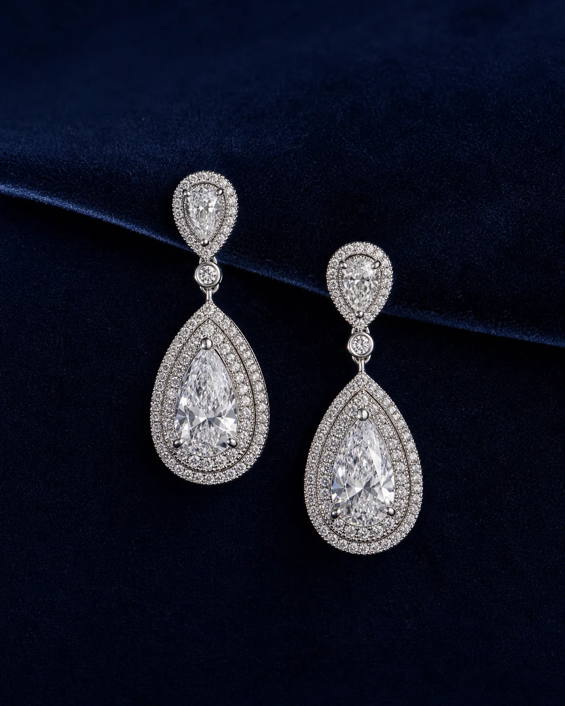 Pear diamond earrings on midnight velvet